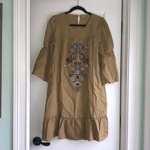 Mustard yellow, embroidered dress.